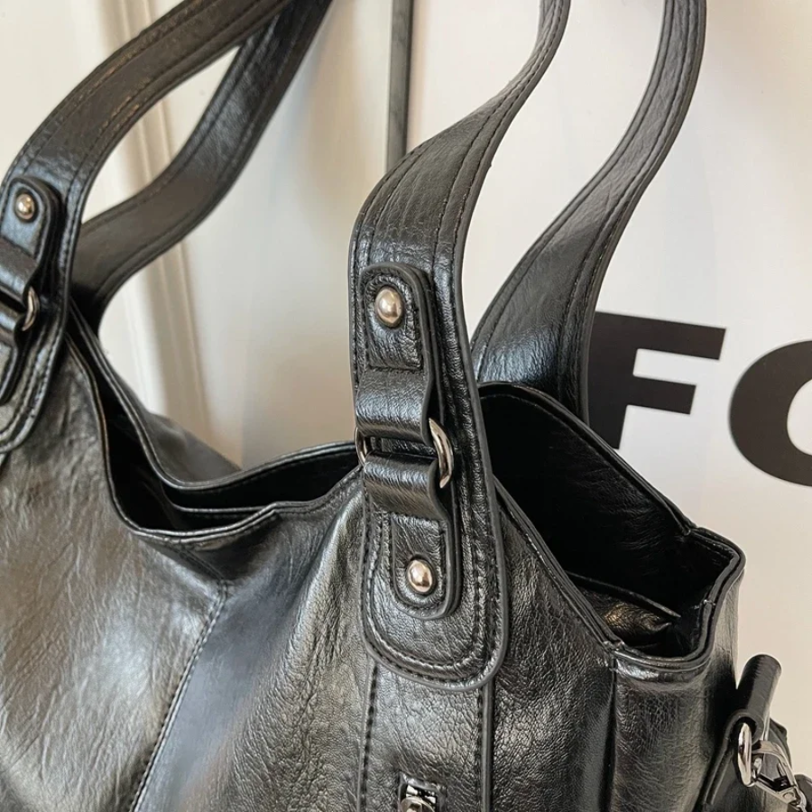 Casual shoulder bag with zippers and adjustable strap