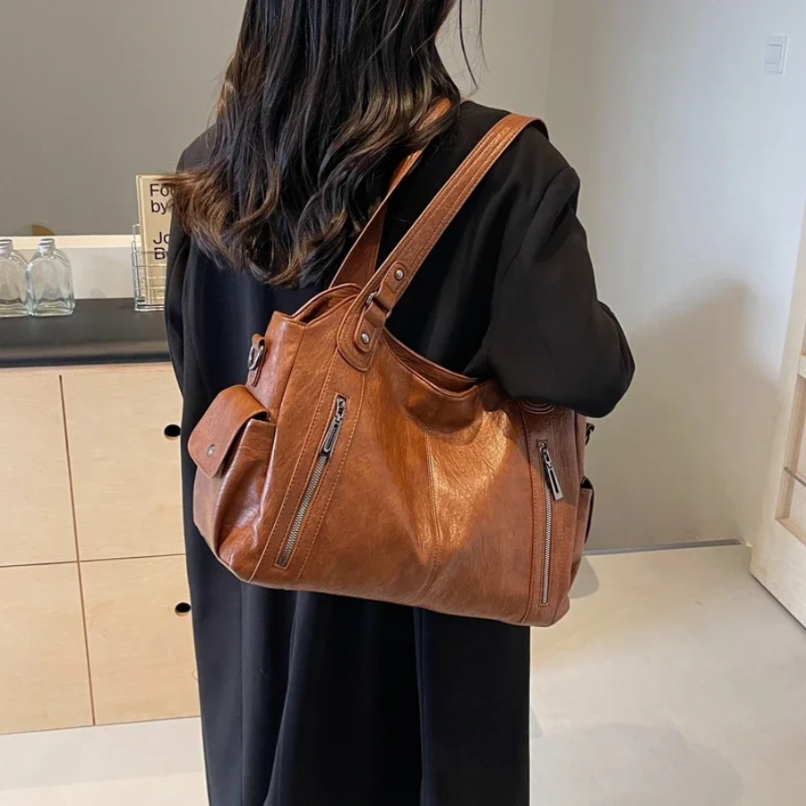 Casual shoulder bag with zippers and adjustable strap