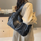 Casual shoulder bag with zippers and adjustable strap