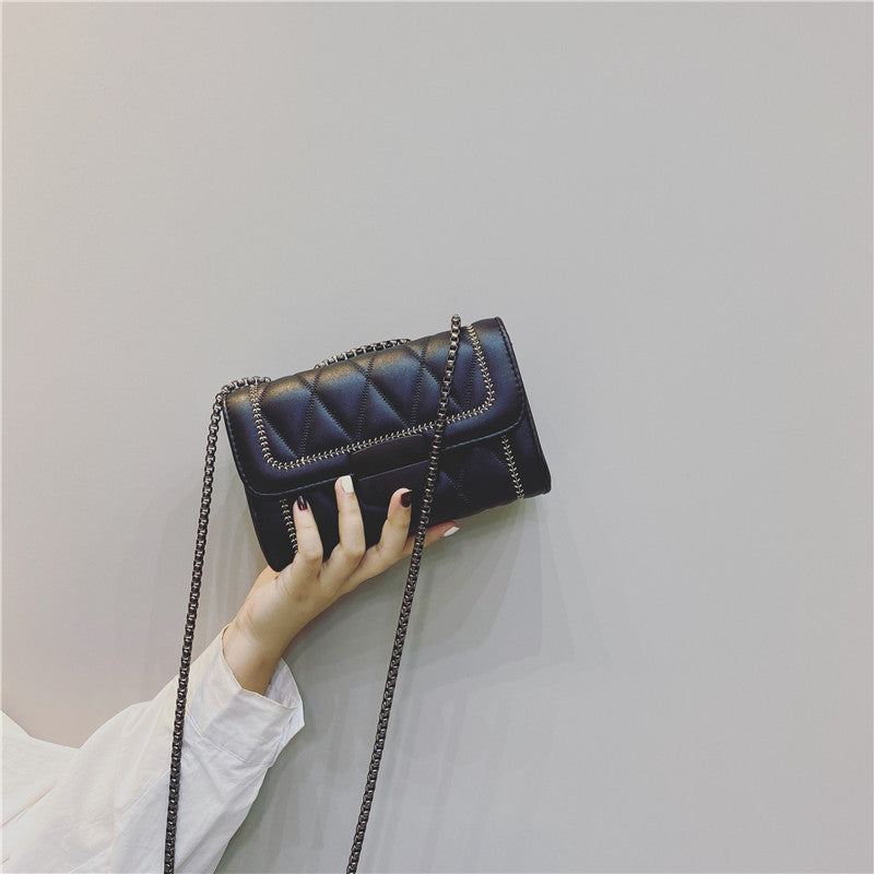 Women's clutch with stylish quilted design and detachable chain strap