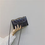 Women's clutch with stylish quilted design and detachable chain strap