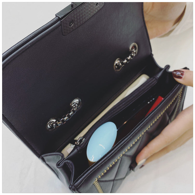 Women's clutch with stylish quilted design and detachable chain strap