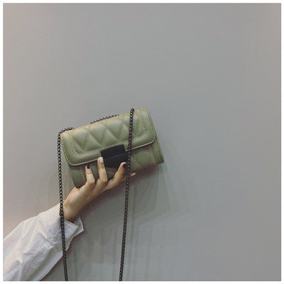 Women's clutch with stylish quilted design and detachable chain strap