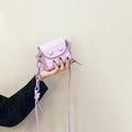 Women’s mini handbag with playful chain pull