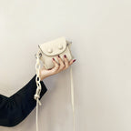 Women’s mini handbag with playful chain pull