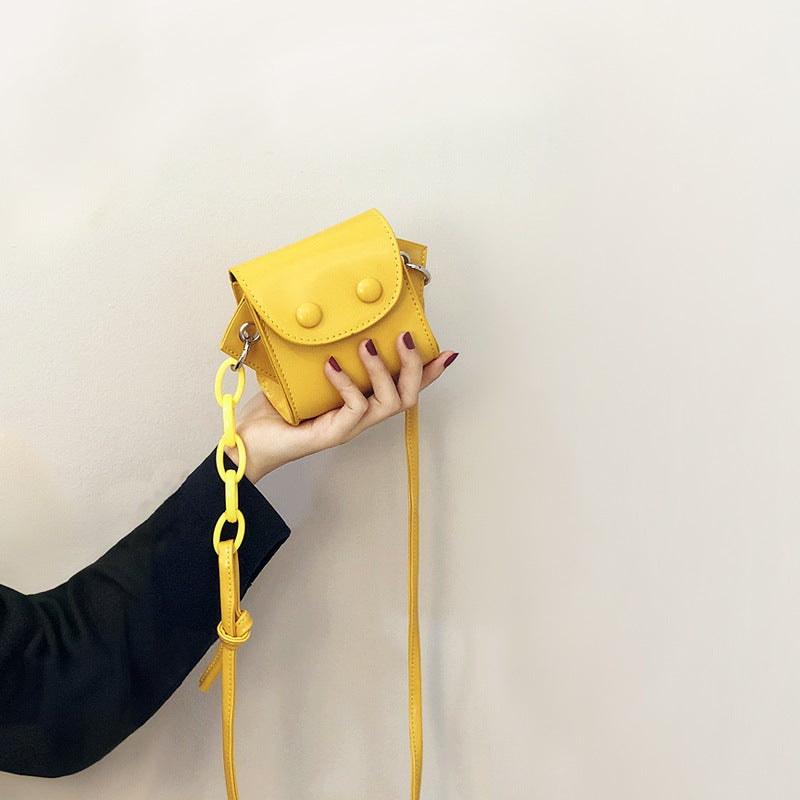 Women’s mini handbag with playful chain pull