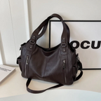 Casual shoulder bag with zippers and adjustable strap