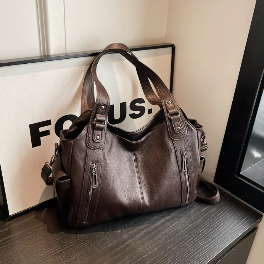 Casual shoulder bag with zippers and adjustable strap