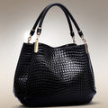 Shoulder bag with crocodile pattern