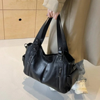 Casual shoulder bag with zippers and adjustable strap