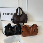 Casual shoulder bag with zippers and adjustable strap