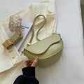 Women's shoulder bag made of PU leather with wide strap