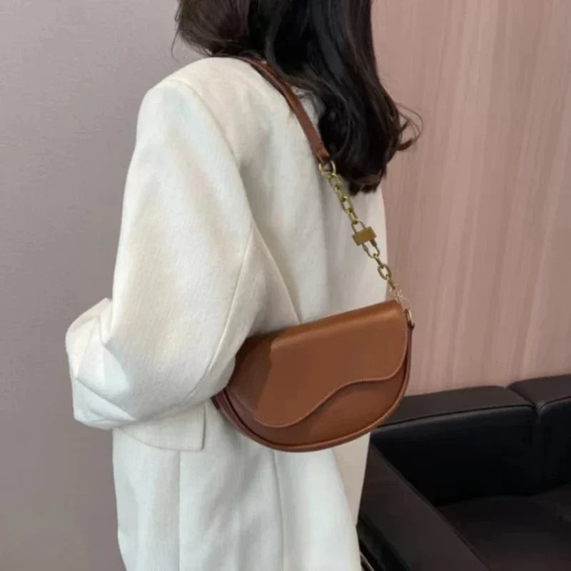 Women's shoulder bag made of PU leather with wide strap