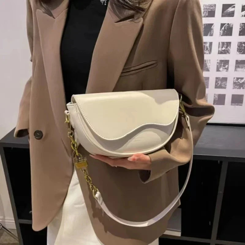 Women's shoulder bag made of PU leather with wide strap