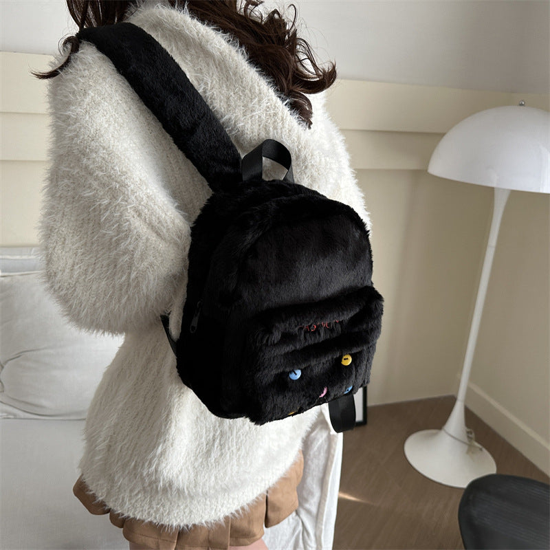 Plush backpack with playful design