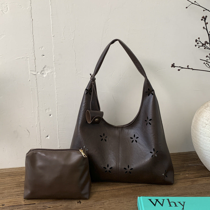 Women's hobo bag with floral design and practical mini organizer