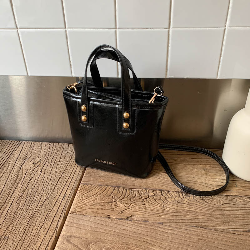 Ladies Mini-Handbag with elegant carry handle and practical inner compartment