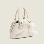 Women’s mini handbag with playful bow accent