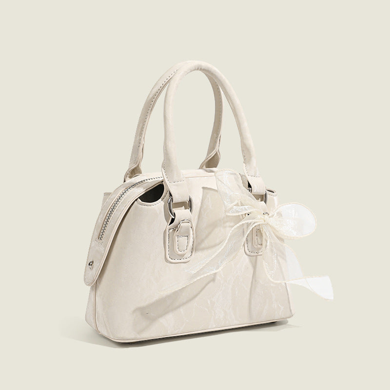 Women’s mini handbag with playful bow accent
