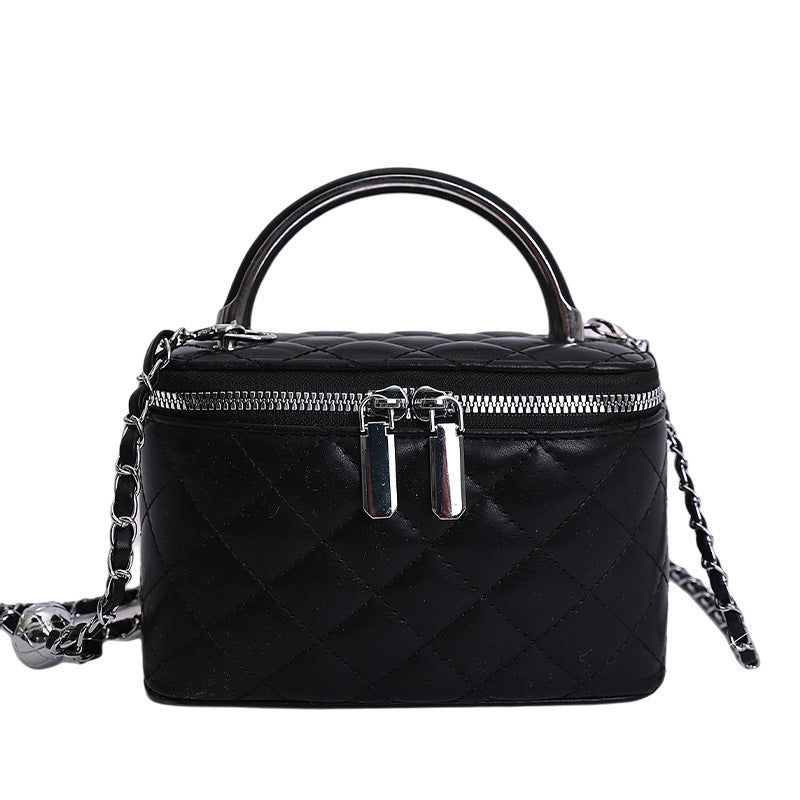 Women's mini handbag with gold chain accent and textured design