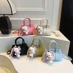 Women’s mini handbag with playful plush pendant