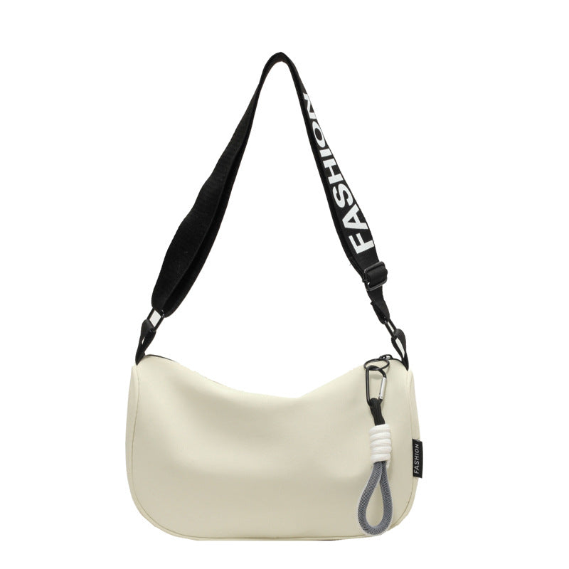 Fashionable shoulder bag with adjustable carrying strap