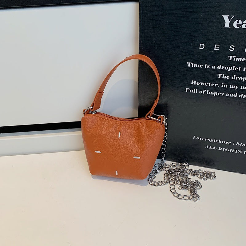 Women's mini handbag with shiny chain and textured upper material