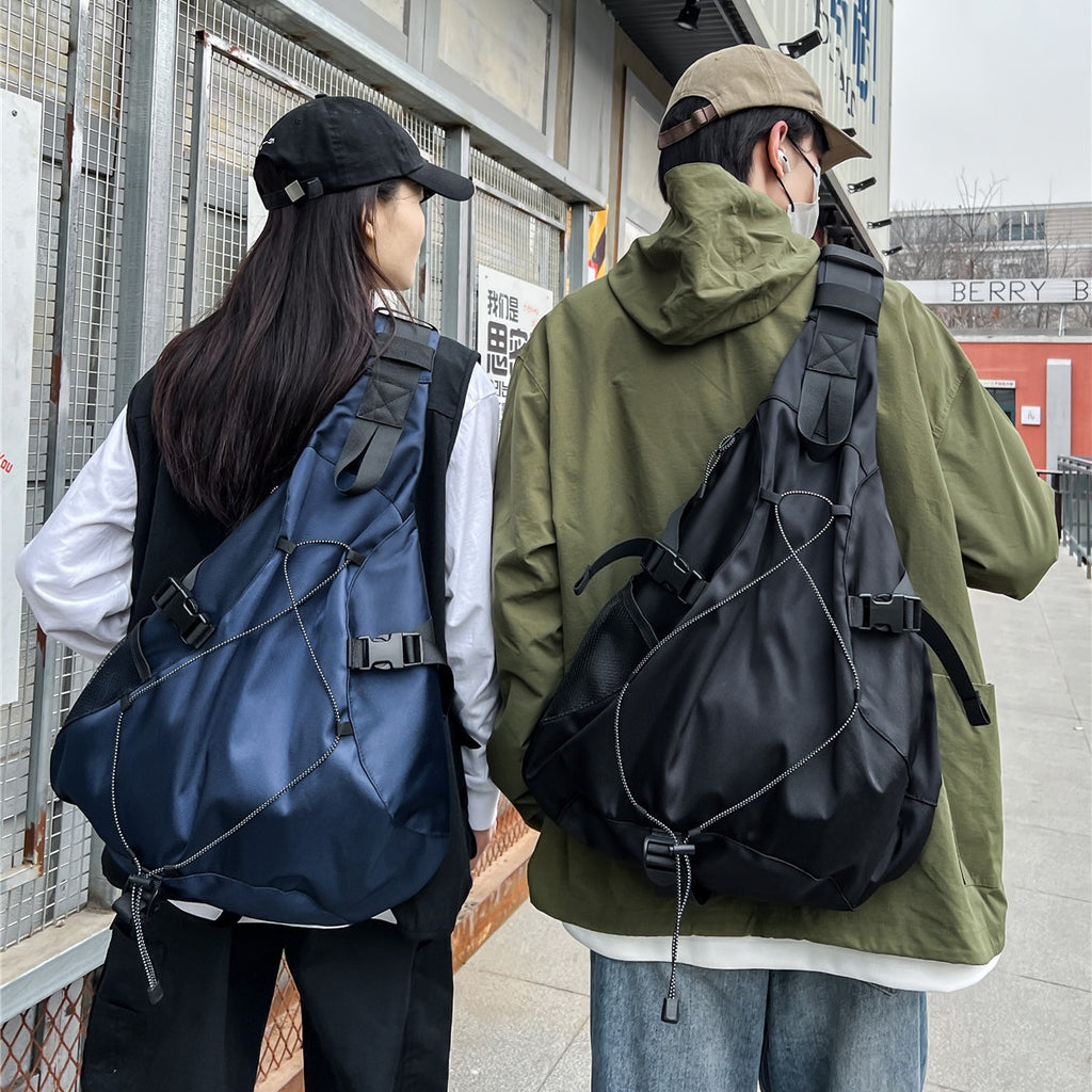 Sporty sling backpack with adjustable straps and practical organizer