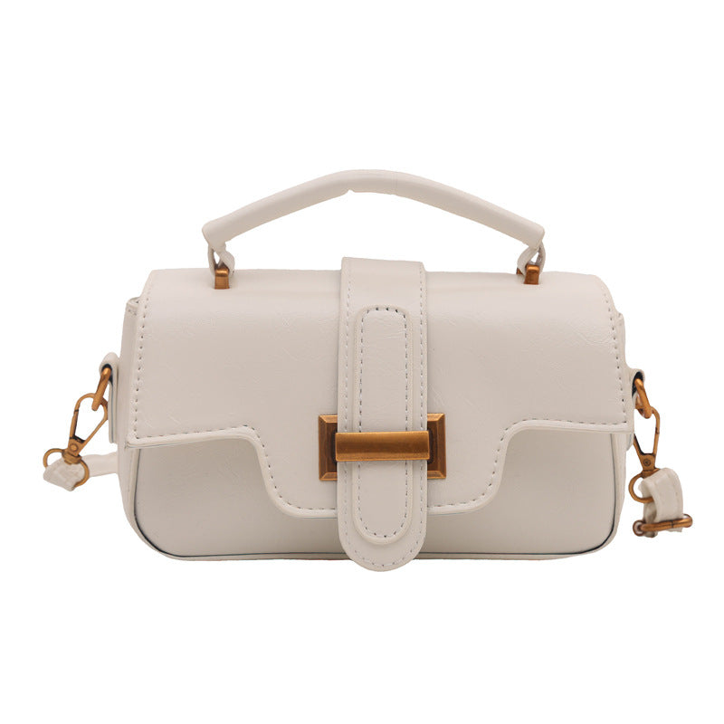 Ladies elegant mini handbag with practical carrying handle and removable shoulder strap