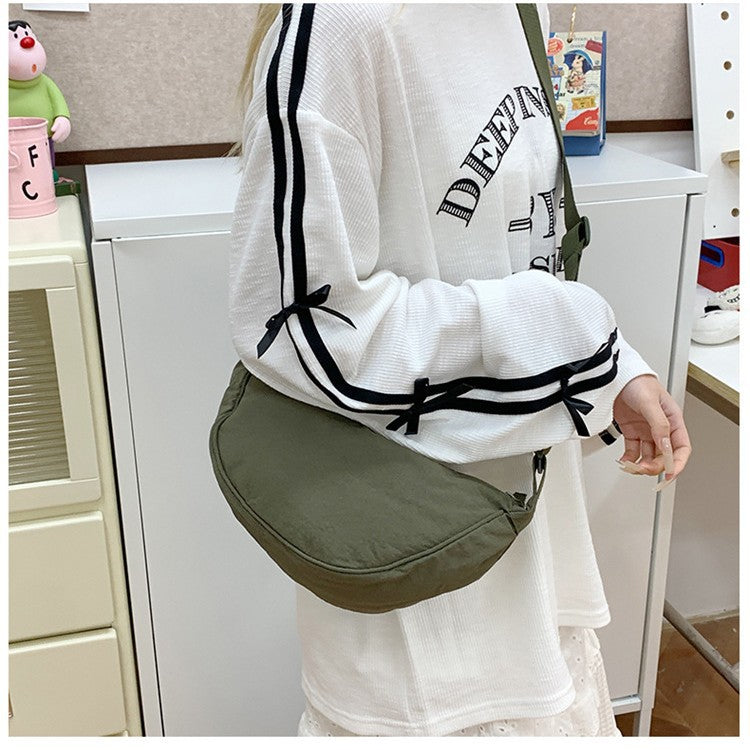 Shoulder bag with adjustable shoulder strap and practical compartments