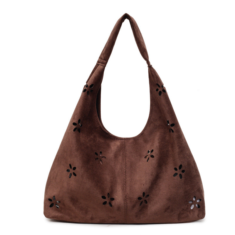 Women's hobo bag with floral accent and practical mini wallet