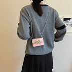 Ladies Mini Handbag with Shimmering Bow Closure