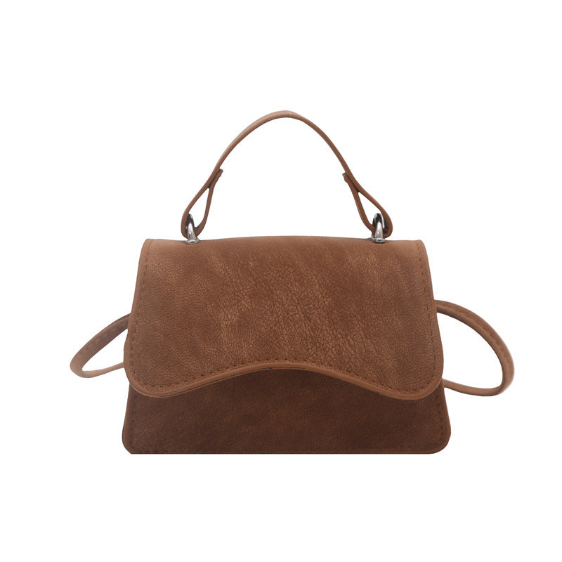 Women's mini handbag with removable carry handle