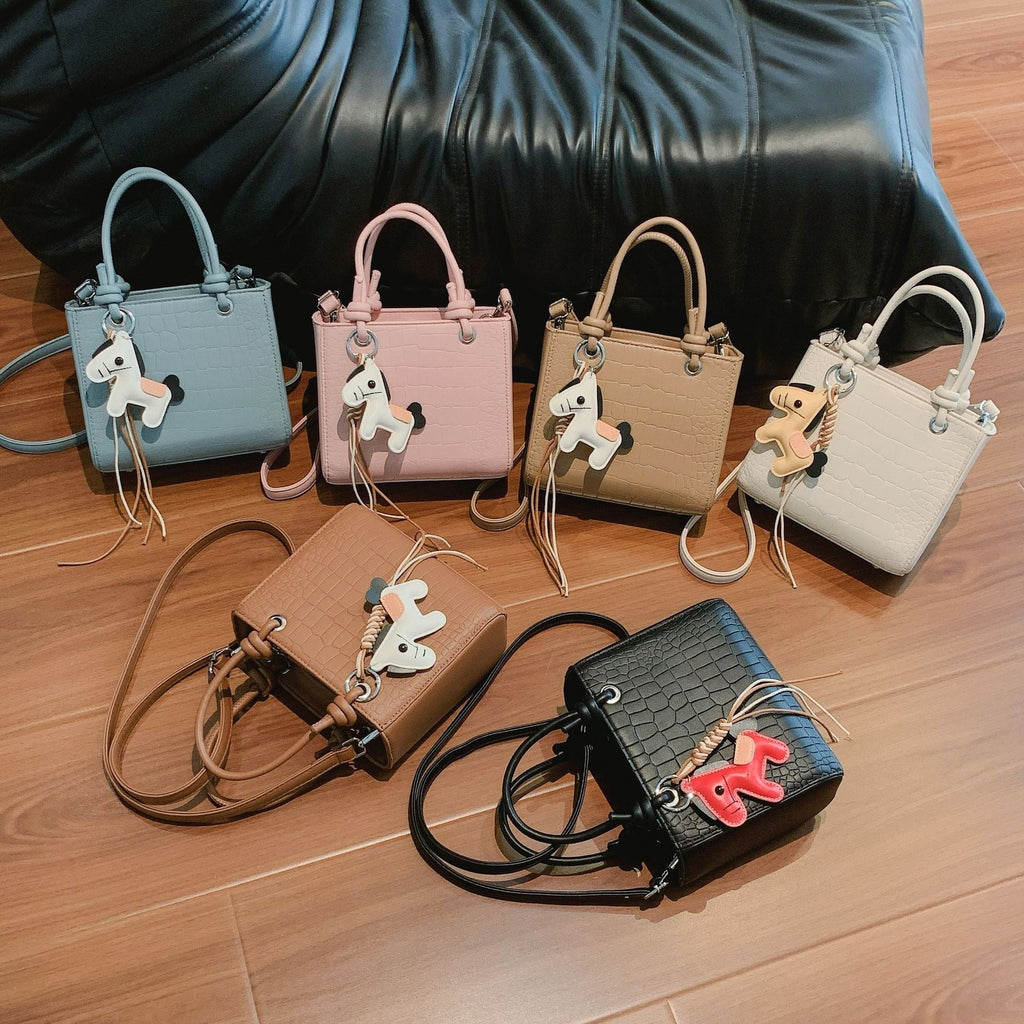 Women's mini bag with animal charm and modern crocodile look