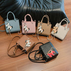 Women's mini bag with animal charm and modern crocodile look