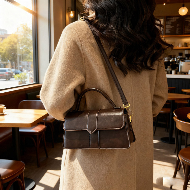 Women's leather handbag with detachable shoulder strap