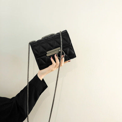 Women's clutch bag with elegant quilting and fine chain strap