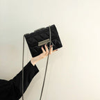 Women's clutch bag with elegant quilting and fine chain strap