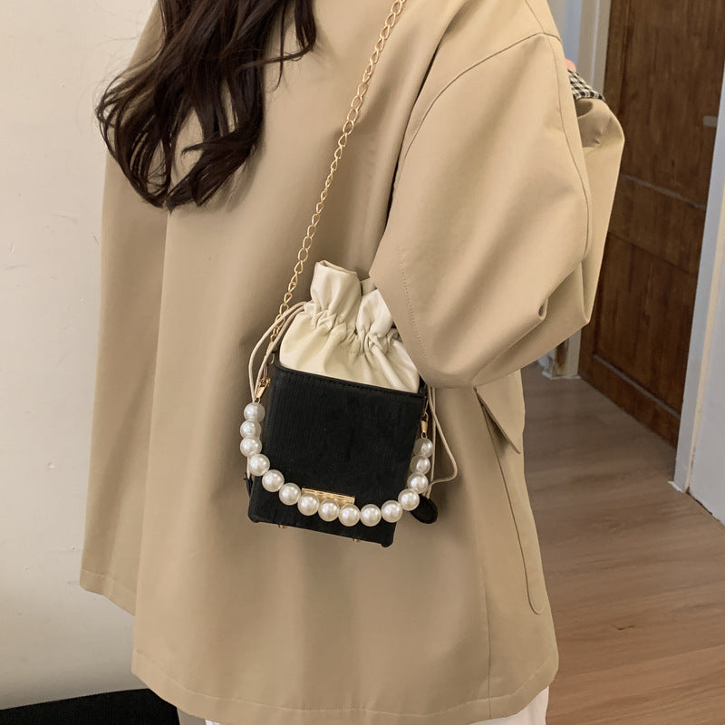 Ladies stylish mini handbag with drawstring and pearl accent