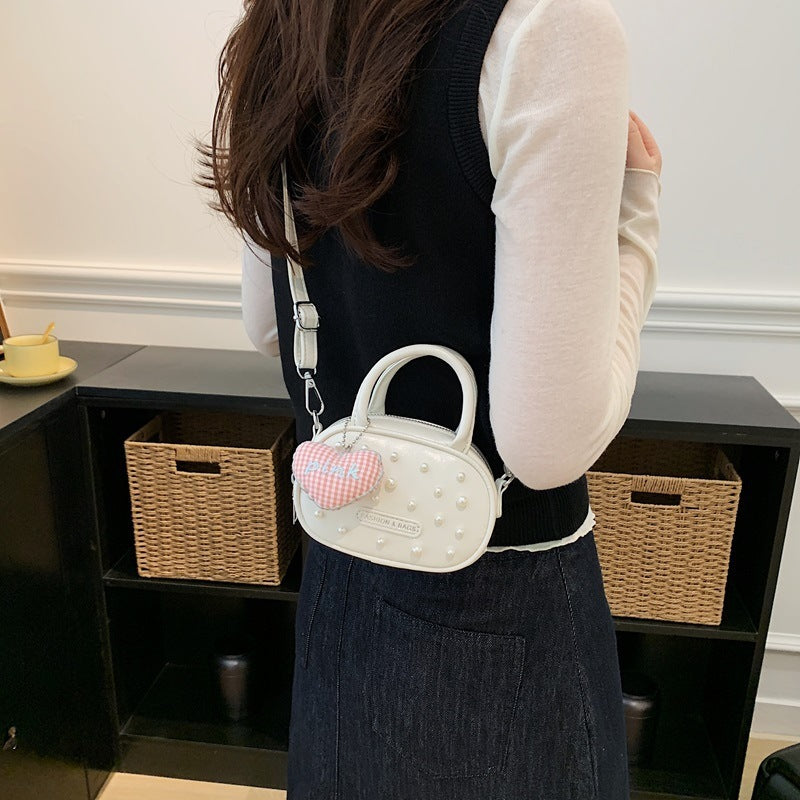 Ladies trendy mini handbag with striking pearl applications