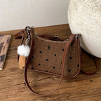 Ladies trendy mini handbag with playful animal charm
