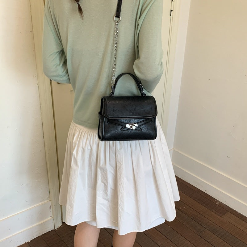 Ladies fashionable mini handbag with decorative magnetic closure
