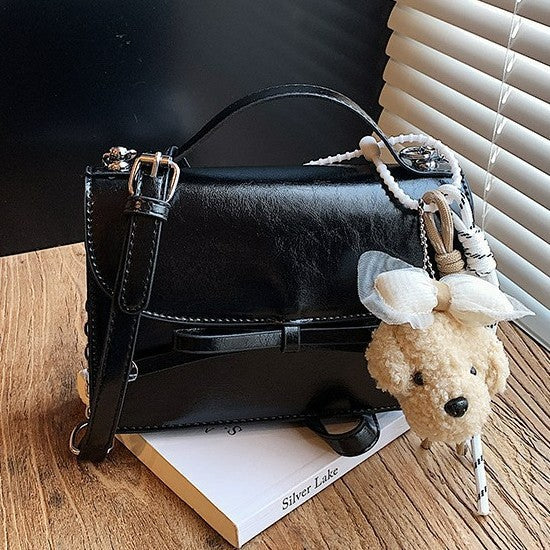 Women elegant mini handbag with cute pendant