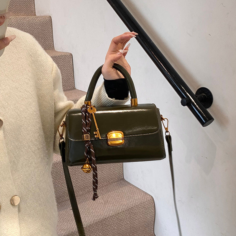 Women's elegant handbag with golden accents