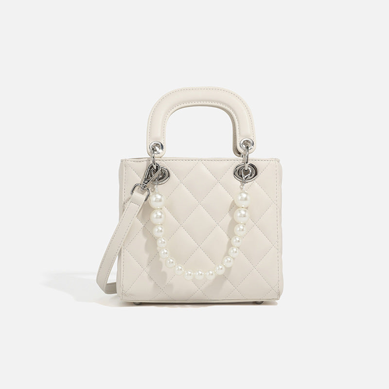 Ladies mini handbag with pearl-embellished chain and quilted design