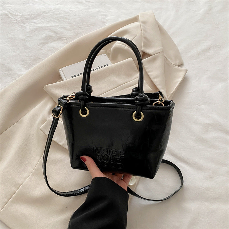 Women elegant mini handbag with structured design and removable shoulder strap