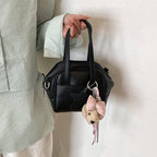Ladies mini bag with decorative pendant