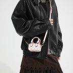 Ladies mini handbag with luxurious accents and adjustable shoulder strap