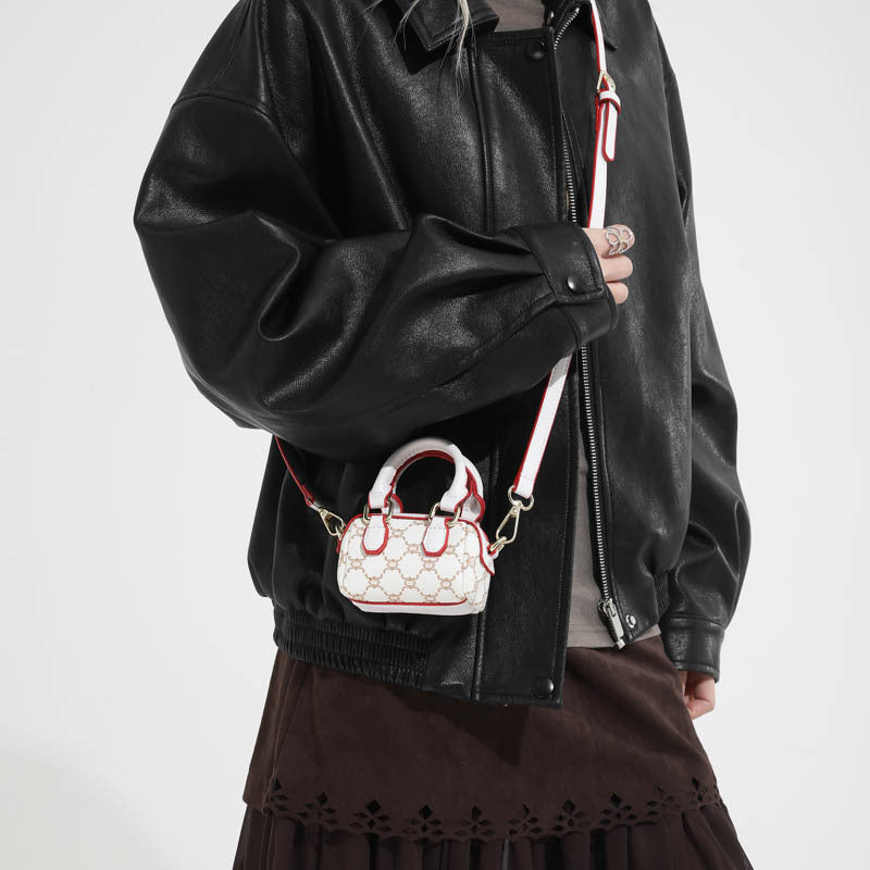Ladies mini handbag with luxurious accents and adjustable shoulder strap