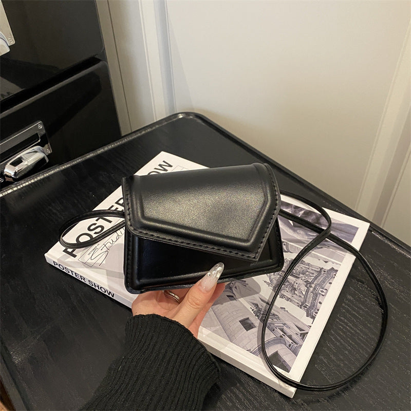 Women's mini handbag with elegant clasp closure technique